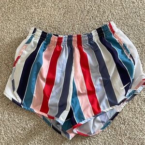 Girls Nike running/soccer shorts. Multi Stripe. Size medium.